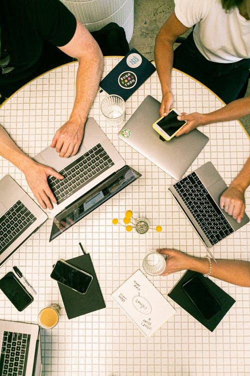 team working on a laptop together