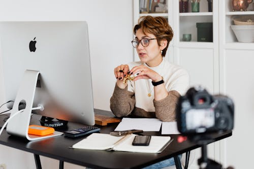 A woman recording an online course from her office