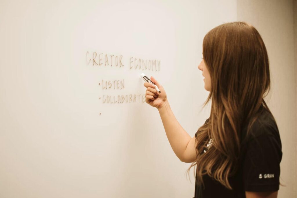 Person planning content strategy on a whiteboard