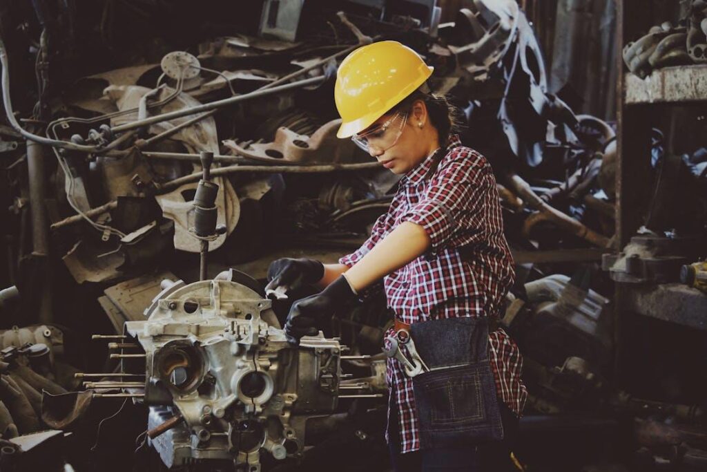 A mechanic working in an auto repair shop with tools