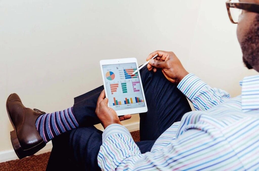 A business owner reviewing their Google Business Profile on a tablet.