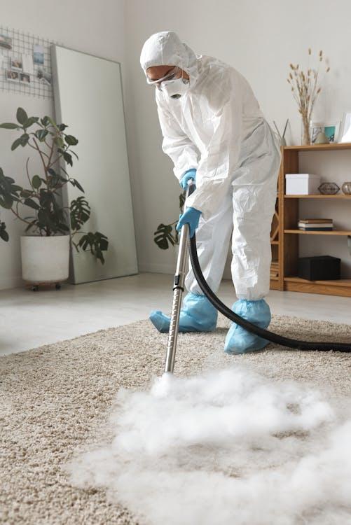 Carpet cleaning professional using a green-certified cleaning solution