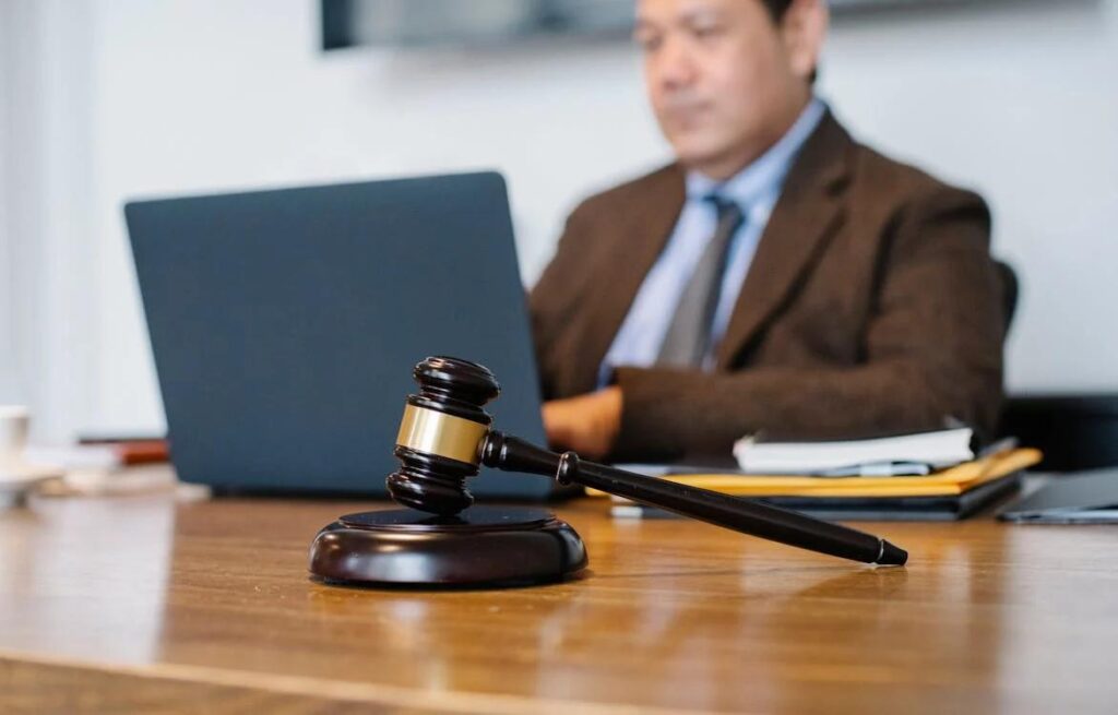 A lawyer reviewing digital marketing analytics on a laptop.