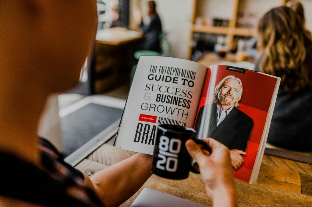 Businessman reading a book for business success