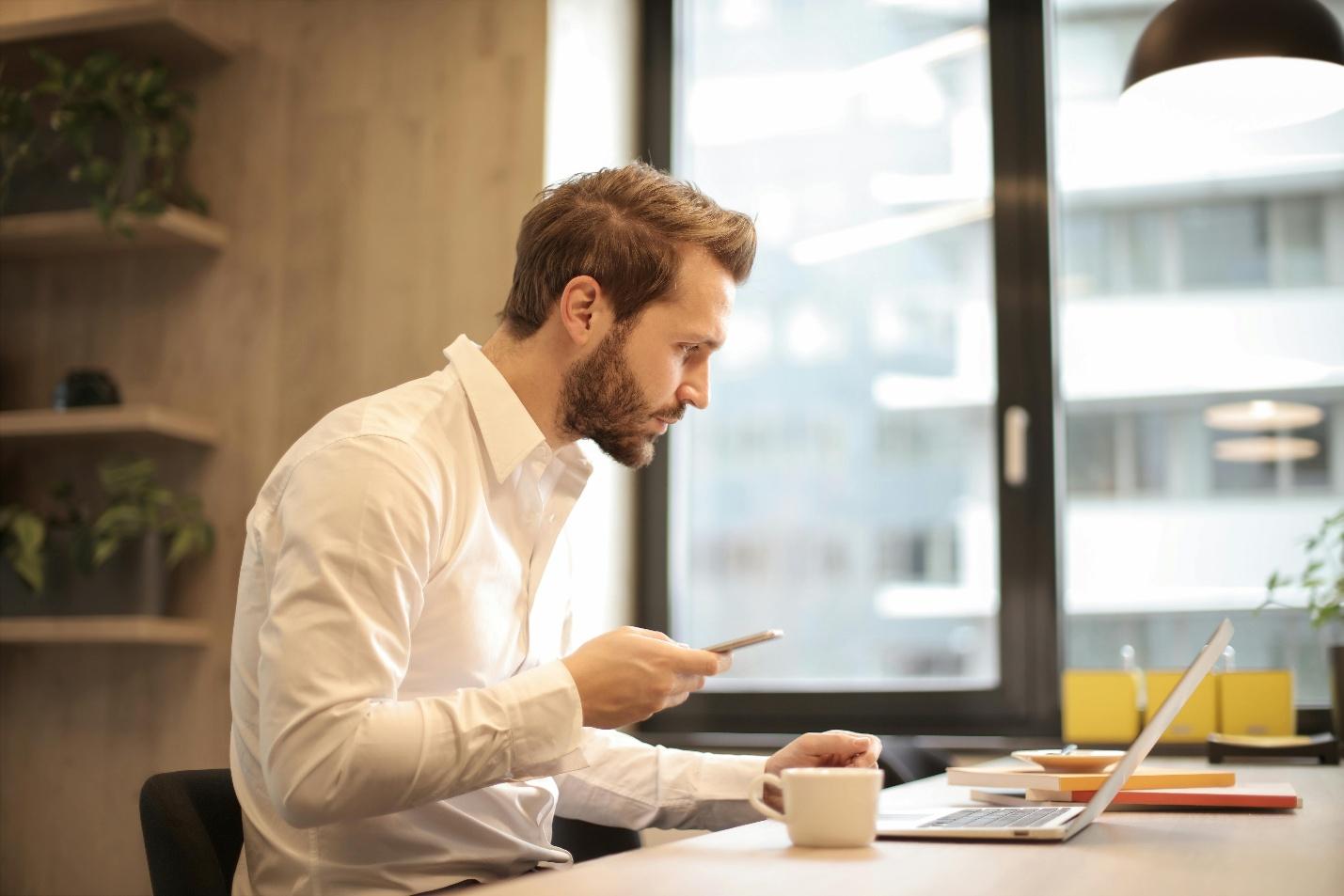 Businessman creating content on a laptop