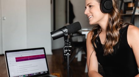 Female podcaster engaging with her listeners